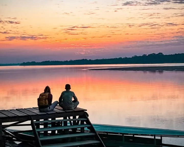 A quiet boat journey at sunset in the Amazon
