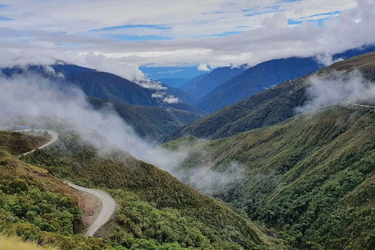 Clouds drifting across the green mountain valleys of Peru